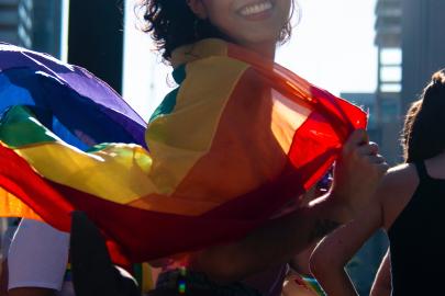 person with LGBTIQ flag