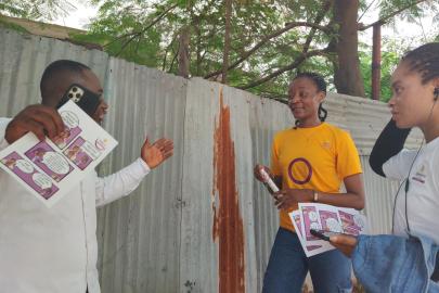 Nigerian activists gather to talk. One wears an intersex flag shirt