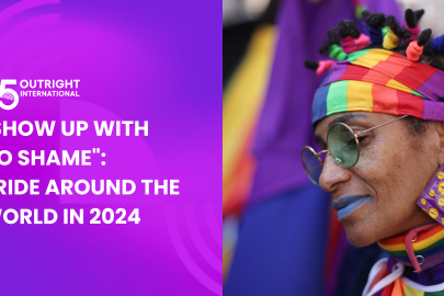 Person with rainbow headband participates in Pride march