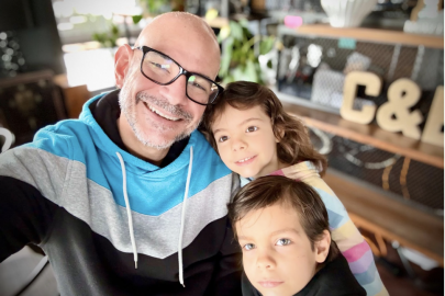 Three people smiling