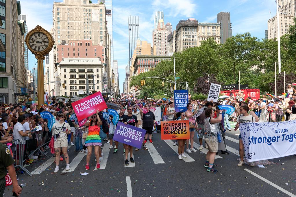 Large group photo of people marching in the street during NY Pride
