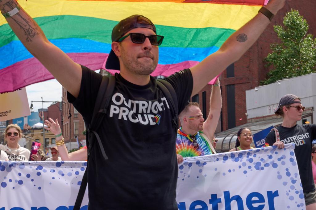 Person holding pride flag
