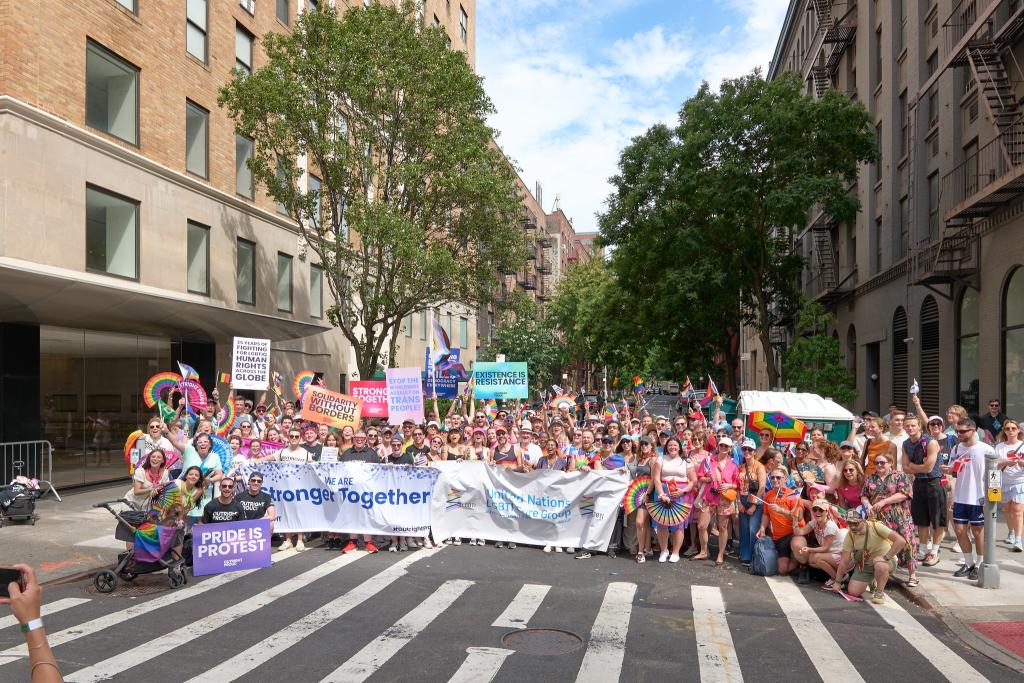Large group photo of people marching in the street during NY Pride