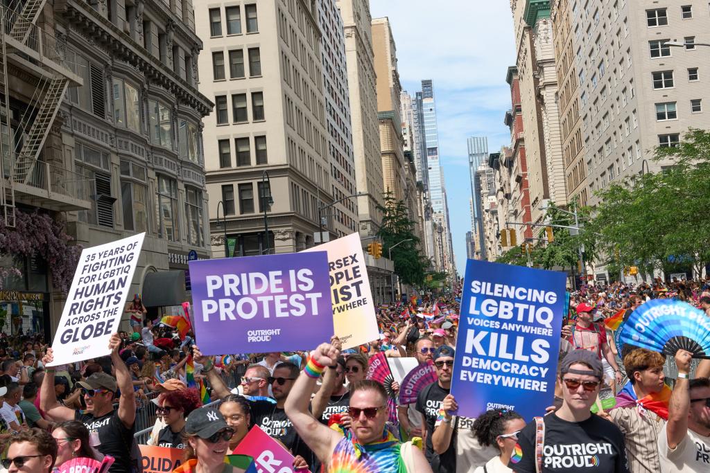 Large group photo of people marching in the street during NY Pride