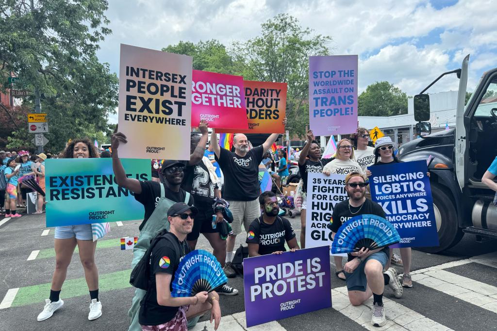 Large group photo of people marching in the street during WorldPride