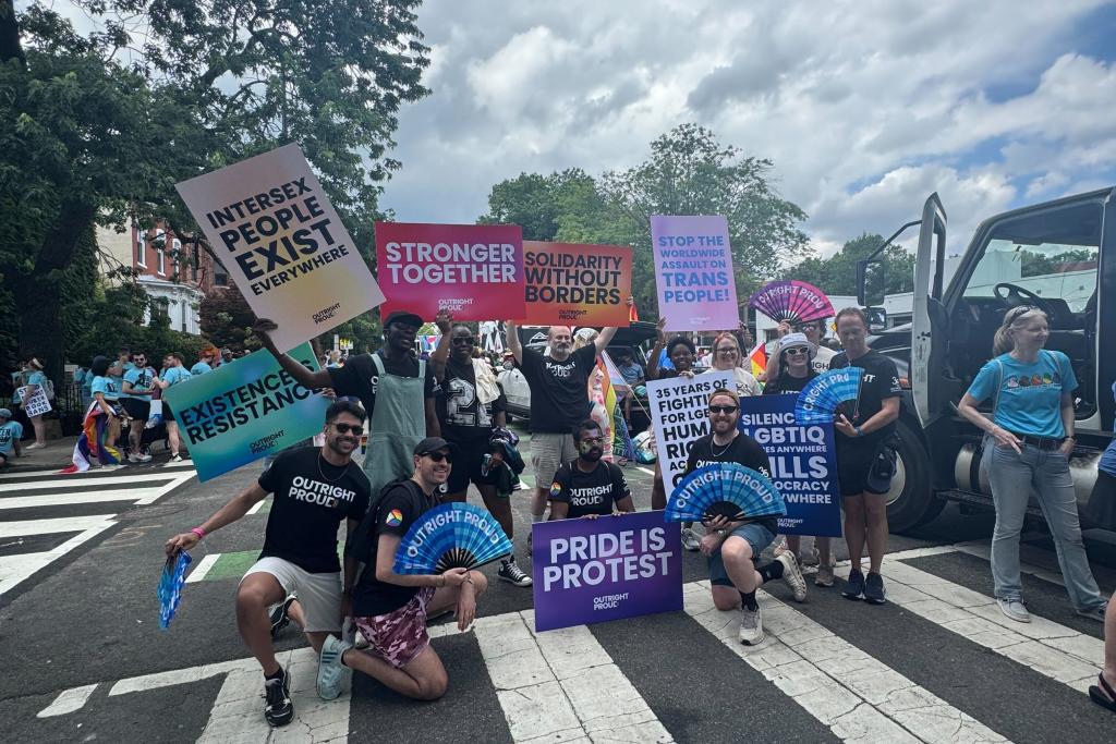 Large group photo of people marching in the street during WorldPride