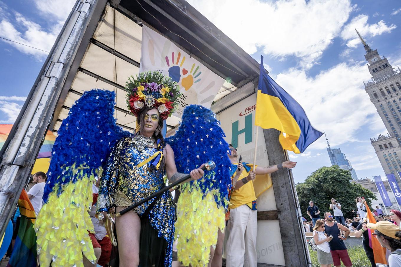 Drag queen Marlen Scandal salutes crowd from the Kyiv Pride float at joint Kyiv-Warsaw Pride