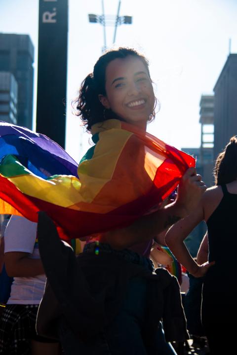 person with LGBTIQ flag