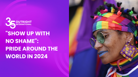 Person with rainbow headband participates in Pride march