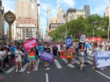 Large group photo of people marching in the street during NY Pride
