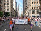 Large group photo of people marching in the street during NY Pride