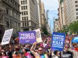 Large group photo of people marching in the street during NY Pride