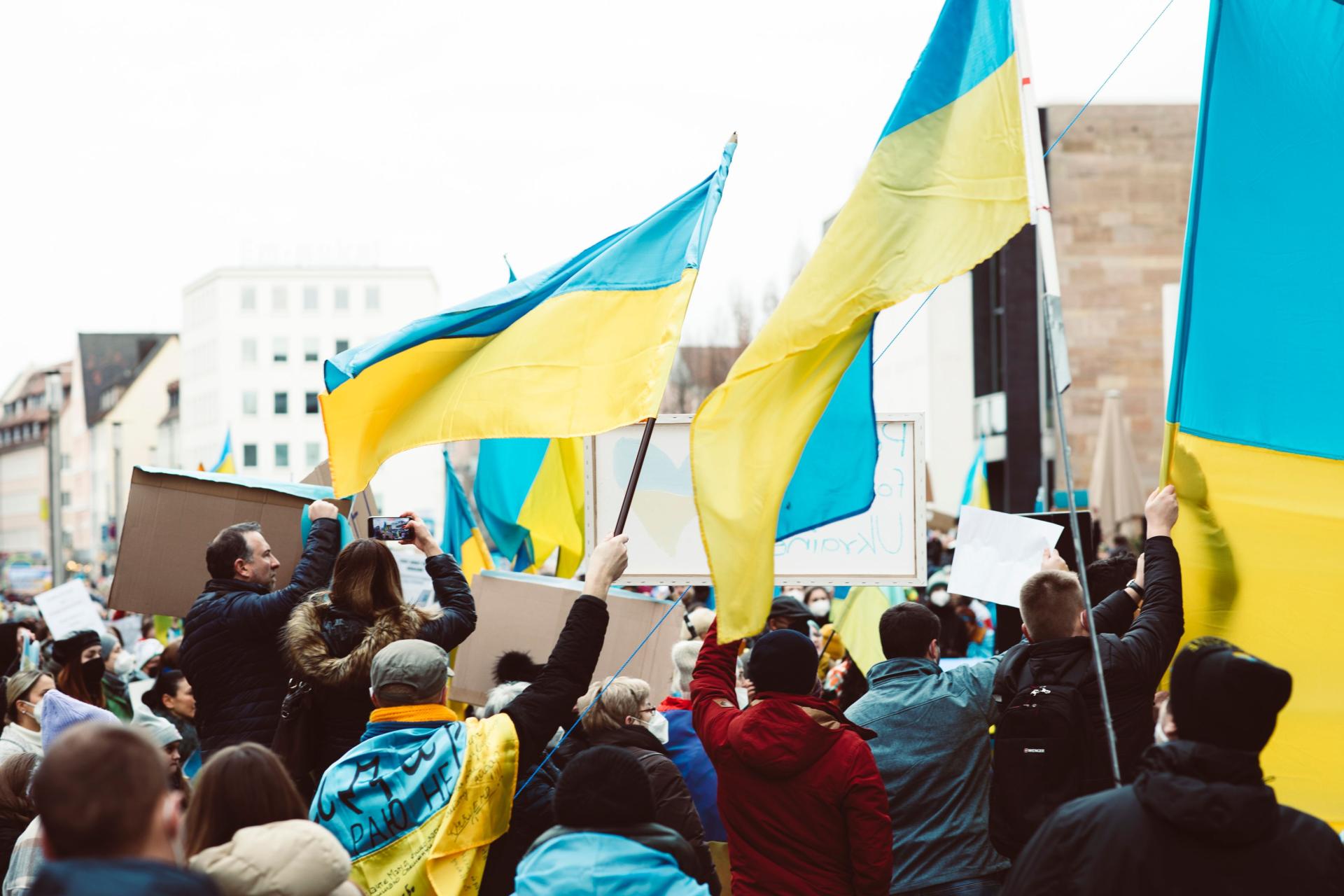 People holding Ukraine flag